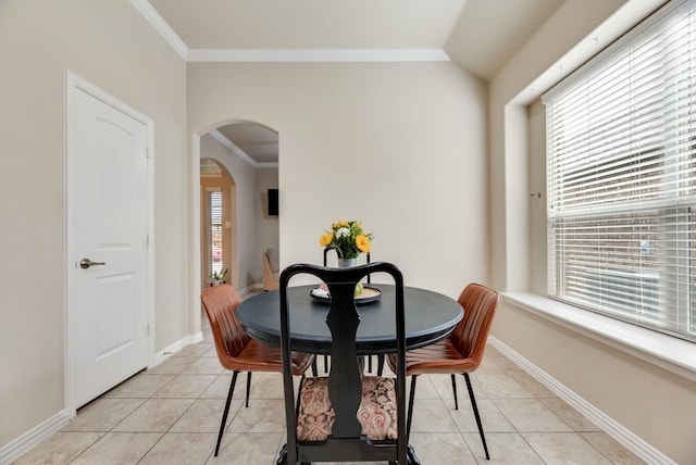 4416 Coney Island Dr, Frisco, TX 75036 - dining room featuring crown molding, light tile patterned flooring, arched walkways, and baseboards