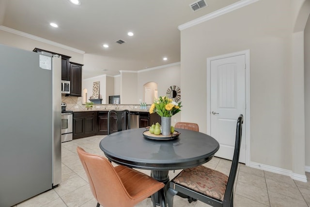 4416 Coney Island Dr, Frisco, TX 75036 - dining room with arched walkways, ornamental molding, and visible vents