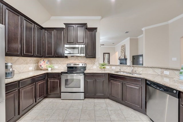 4416 Coney Island Dr, Frisco, TX 75036 - kitchen with backsplash, crown molding, appliances with stainless steel finishes, and a sink