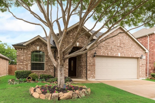 4416 Coney Island Dr, Frisco, TX 75036 - view of front facade with driveway, brick siding, an attached garage, and a front yard