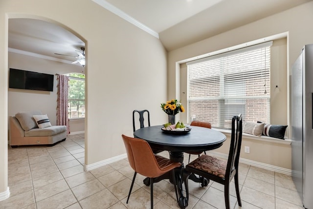 4416 Coney Island Dr, Frisco, TX 75036 - dining room featuring crown molding, light tile patterned floors, baseboards, and ceiling fan