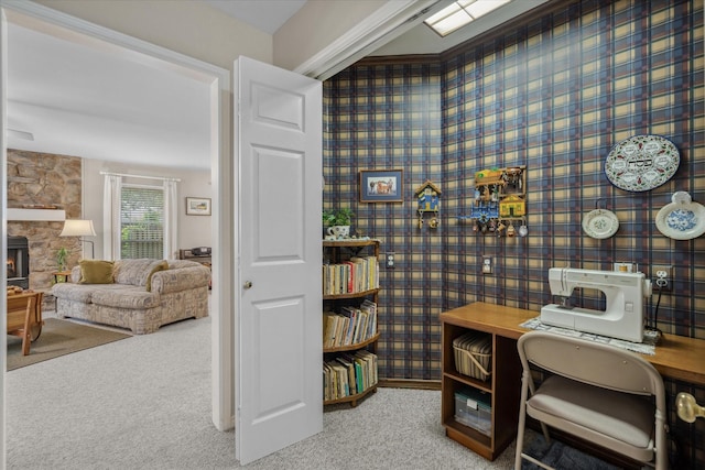 office area with a fireplace, wallpapered walls, and carpet floors