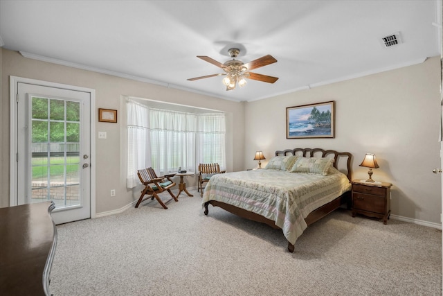 carpeted bedroom with access to exterior, visible vents, baseboards, ceiling fan, and ornamental molding