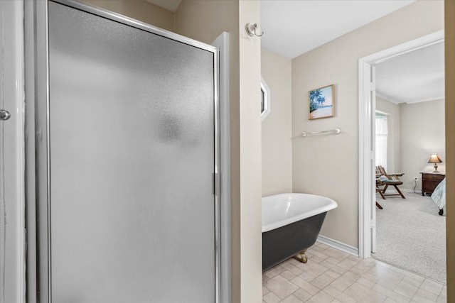 full bath featuring a soaking tub, baseboards, and a shower stall