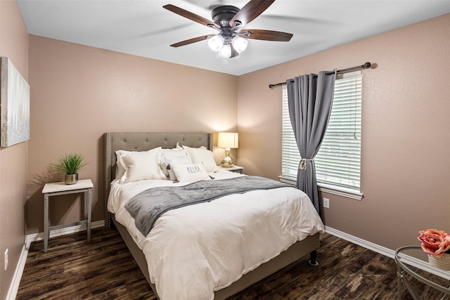 bedroom with wood finished floors, baseboards, and ceiling fan