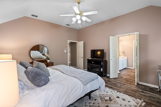 bedroom featuring vaulted ceiling, dark wood-style floors, baseboards, and a ceiling fan