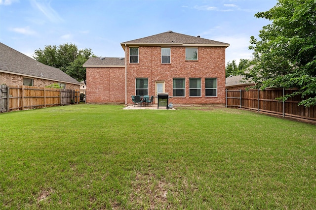 back of house featuring brick siding, a patio, and a shingled roof