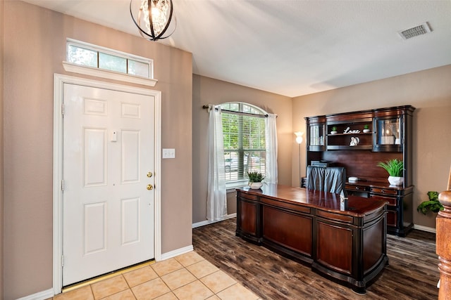 office space with baseboards and wood finished floors