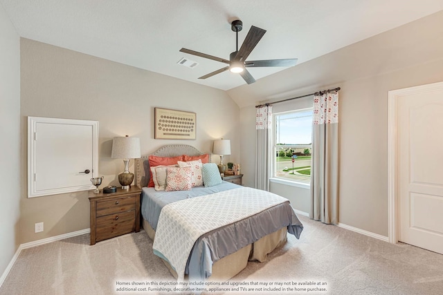 bedroom featuring visible vents, baseboards, lofted ceiling, and light carpet
