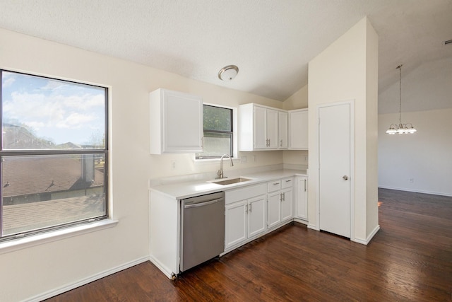 kitchen with a sink, dark wood finished floors, an inviting chandelier, white cabinets, and stainless steel dishwasher