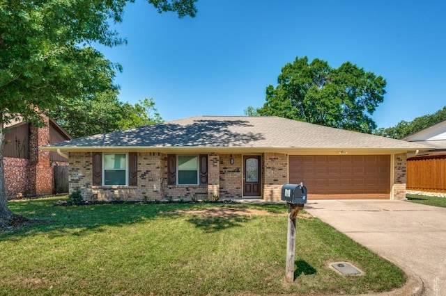 ranch-style home featuring brick siding, fence, an attached garage, concrete driveway, and a front lawn