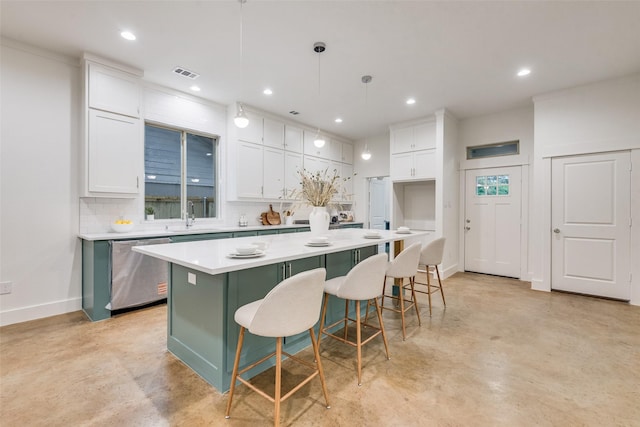 kitchen featuring concrete floors, a sink, white cabinetry, dishwasher, and a kitchen island
