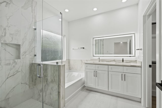 7819 Brownsville Ave, Dallas, TX 75216 - bathroom with a sink, a marble finish shower, recessed lighting, double vanity, and a bath