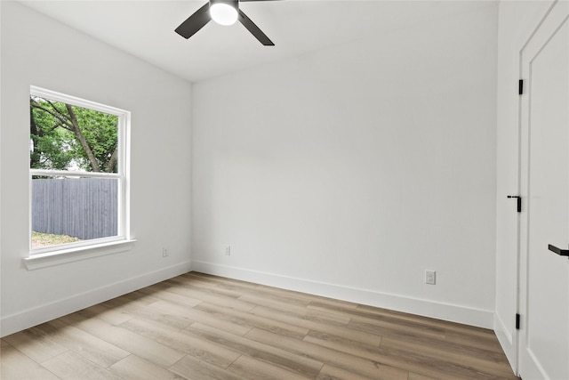 7819 Brownsville Ave, Dallas, TX 75216 - unfurnished room with light wood-style flooring, baseboards, and ceiling fan