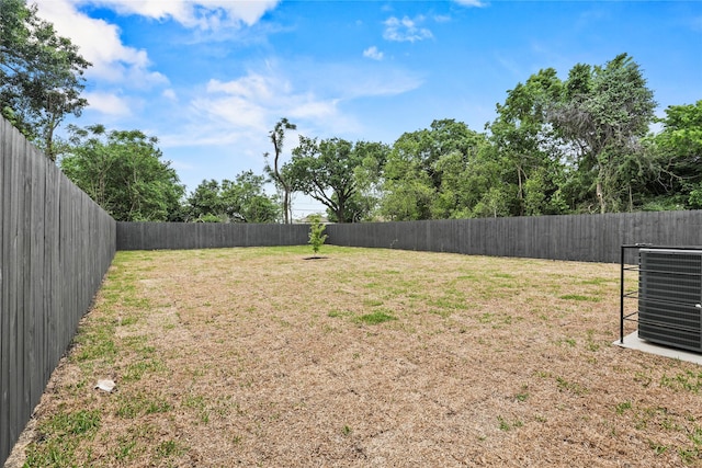 7819 Brownsville Ave, Dallas, TX 75216 - view of yard featuring cooling unit and a fenced backyard
