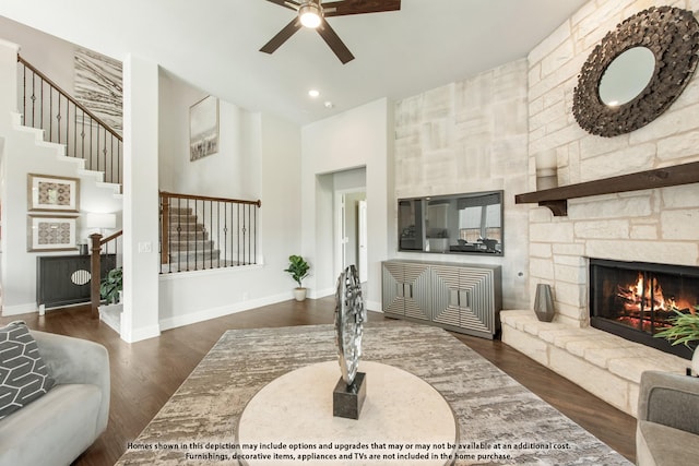 4029 Alpine St, Midlothian, TX 76065 - living room featuring stairs, a towering ceiling, a fireplace, dark wood-style flooring, and a ceiling fan