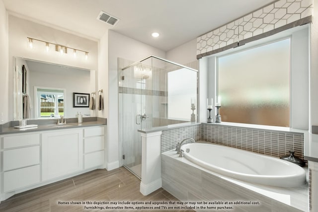 4029 Alpine St, Midlothian, TX 76065 - bathroom with vanity, a garden tub, a shower stall, and visible vents