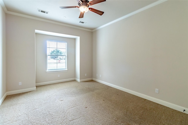 unfurnished room with crown molding, visible vents, ceiling fan, and light carpet