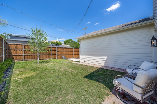 view of yard with a fenced backyard