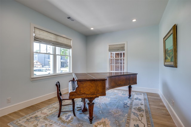 office featuring baseboards, recessed lighting, visible vents, and wood finished floors