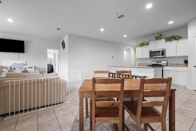 716 Emmons Creek St, Justin, TX 76247 - dining space featuring light tile patterned floors, visible vents, and recessed lighting