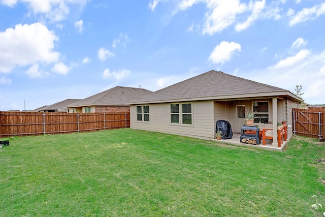 716 Emmons Creek St, Justin, TX 76247 - back of house featuring a patio area, roof with shingles, a lawn, and a fenced backyard