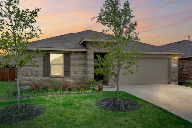 716 Emmons Creek St, Justin, TX 76247 - view of front of house with fence, brick siding, concrete driveway, a garage, and a lawn