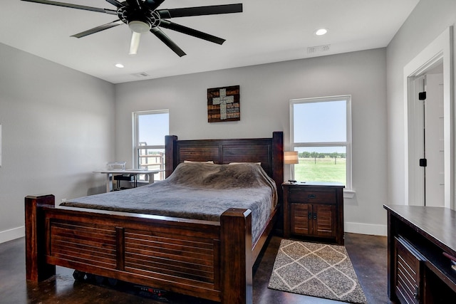 bedroom featuring visible vents, finished concrete flooring, baseboards, and recessed lighting
