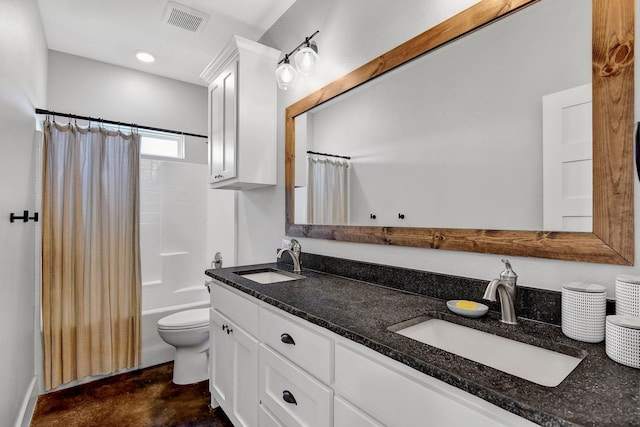 full bath featuring double vanity, visible vents, finished concrete flooring, and a sink