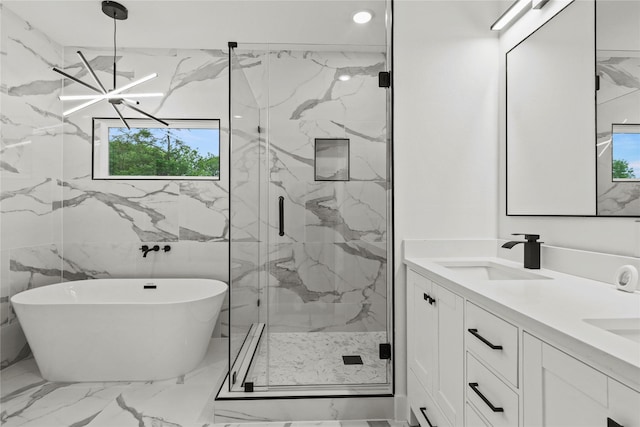 full bathroom with a wealth of natural light, a marble finish shower, marble finish floor, and a sink