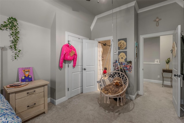 bedroom featuring baseboards, light carpet, and lofted ceiling