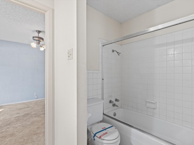 113 Delmore Dr, Hillsboro, TX 76645 - full bathroom featuring a textured ceiling, toilet, and shower / tub combination