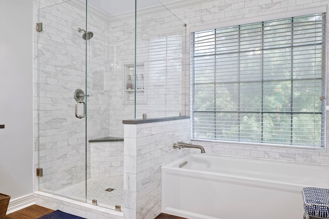 5125 Golden Ln, Fort Worth, TX 76123 - bathroom with a garden tub, a shower stall, and wood finished floors