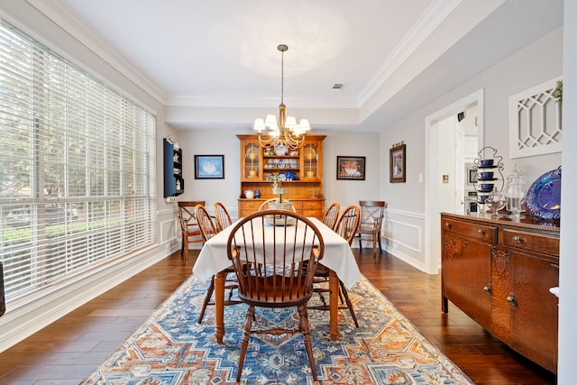 5125 Golden Ln, Fort Worth, TX 76123 - dining room featuring crown molding, dark wood-type flooring, a decorative wall, visible vents, and a chandelier