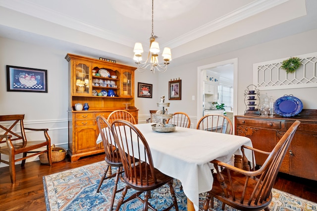 5125 Golden Ln, Fort Worth, TX 76123 - dining space featuring dark wood-style flooring, a notable chandelier, and crown molding