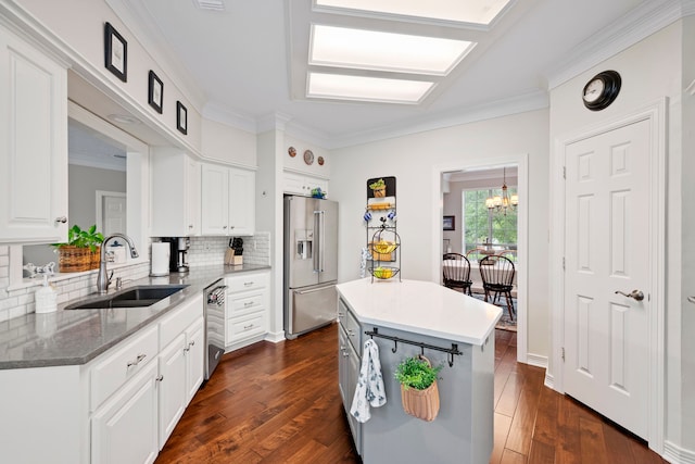 5125 Golden Ln, Fort Worth, TX 76123 - kitchen with a sink, crown molding, stainless steel appliances, and tasteful backsplash
