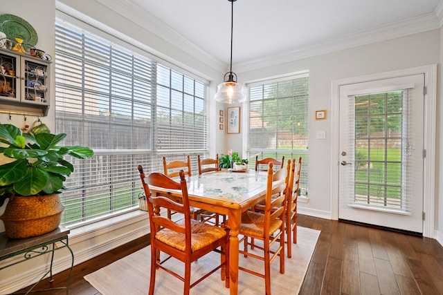 5125 Golden Ln, Fort Worth, TX 76123 - dining room featuring crown molding, baseboards, and wood-type flooring