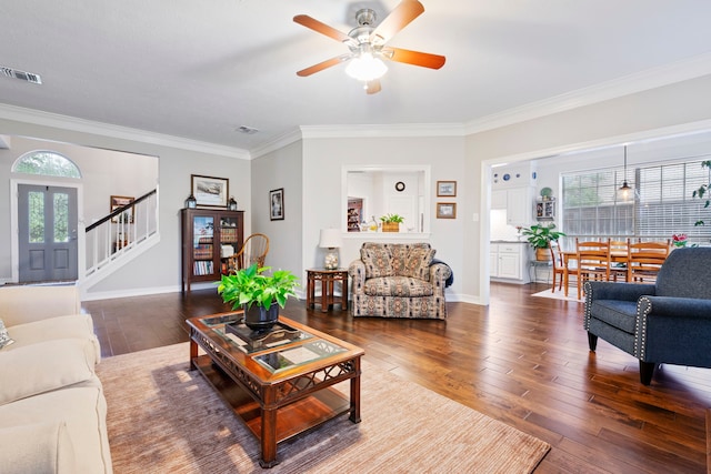 5125 Golden Ln, Fort Worth, TX 76123 - living room featuring a ceiling fan, stairway, ornamental molding, and dark wood-style floors