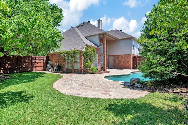 4600 Winter Park Dr, Richardson, TX 75082 - back of house featuring brick siding, a patio, a chimney, and a shingled roof