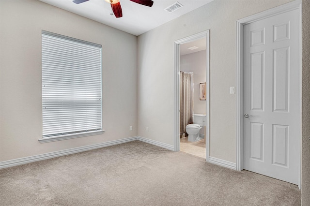 4600 Winter Park Dr, Richardson, TX 75082 - unfurnished bedroom featuring carpet, connected bathroom, baseboards, and ceiling fan