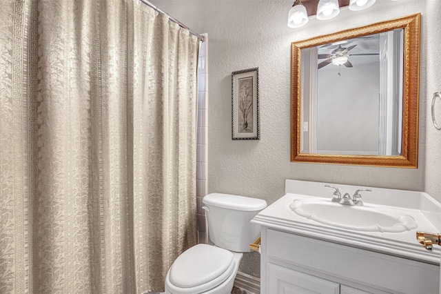 4600 Winter Park Dr, Richardson, TX 75082 - bathroom featuring a textured wall, ceiling fan, toilet, vanity, and a shower with curtain