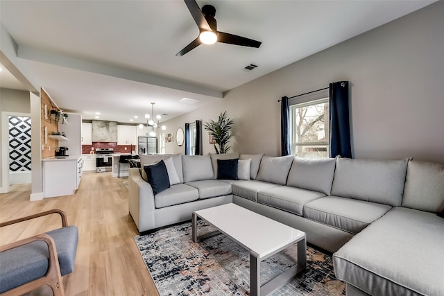 807 Florence St, Mckinney, TX 75069 - living room featuring ceiling fan with notable chandelier, light wood-type flooring, visible vents, and recessed lighting
