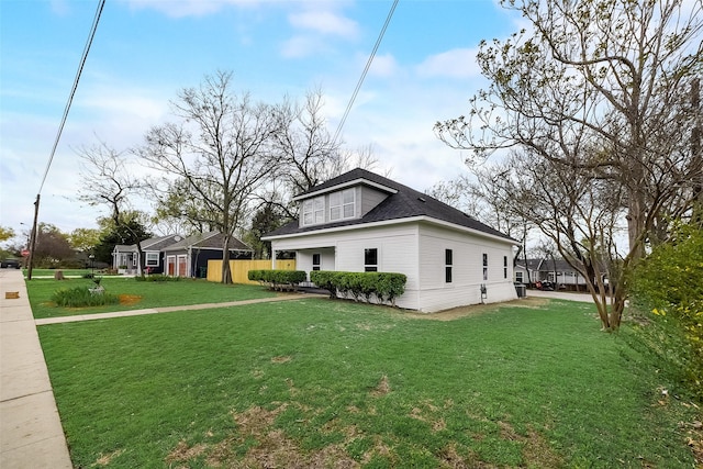 807 Florence St, Mckinney, TX 75069 - view of side of home with a yard and a shingled roof