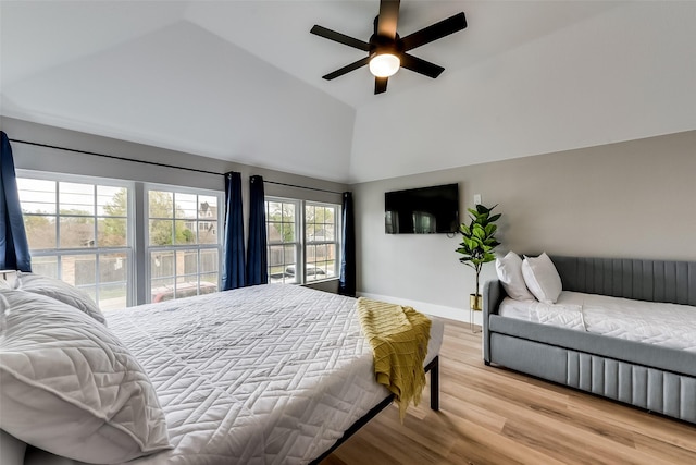807 Florence St, Mckinney, TX 75069 - bedroom featuring baseboards, high vaulted ceiling, a ceiling fan, and light wood-style floors