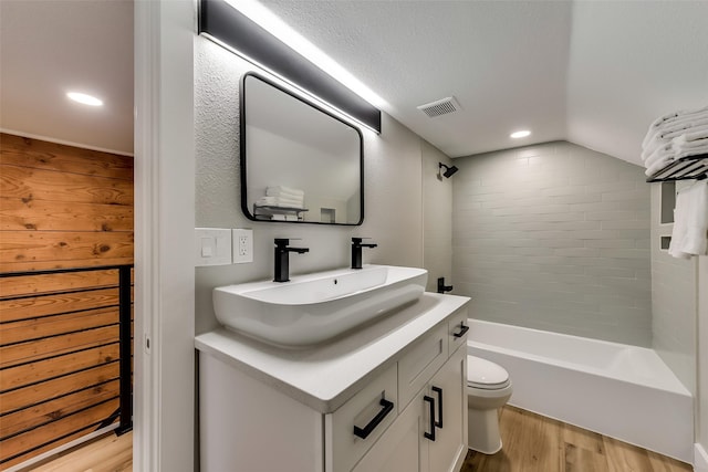 807 Florence St, Mckinney, TX 75069 - full bath featuring toilet, visible vents, shower / tub combination, vanity, and wood finished floors