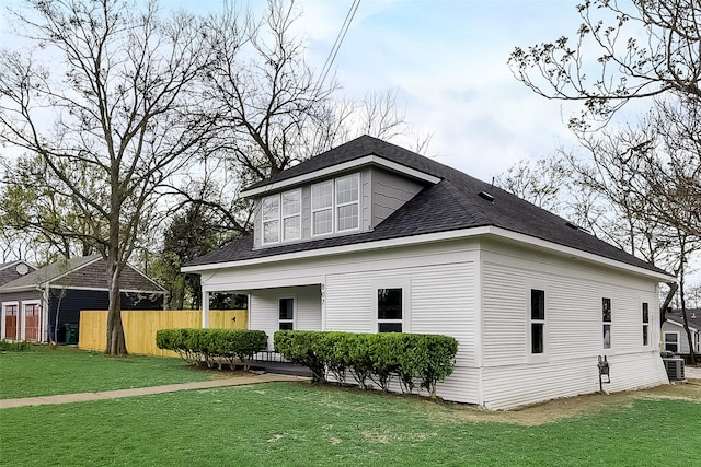 807 Florence St, Mckinney, TX 75069 - exterior space featuring a lawn, a shingled roof, and fence