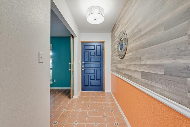 interior space featuring tile patterned floors and baseboards