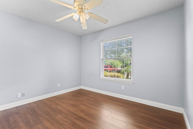 304 E Clover Park Dr, Fort Worth, TX 76140 - empty room with baseboards, a textured ceiling, and wood finished floors