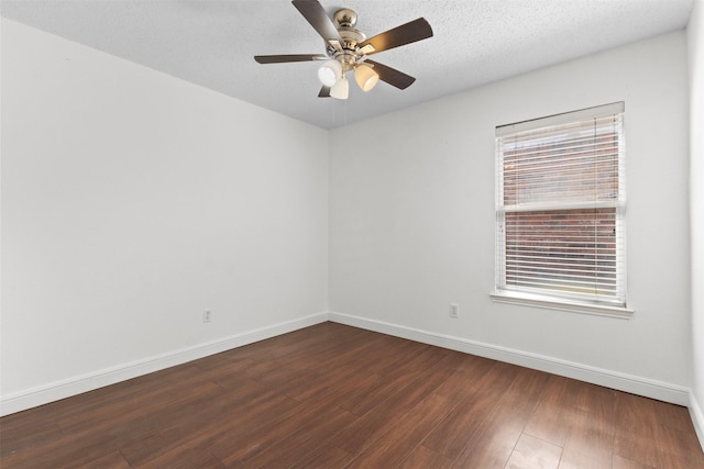 304 E Clover Park Dr, Fort Worth, TX 76140 - empty room featuring baseboards, a ceiling fan, and dark wood-style floors