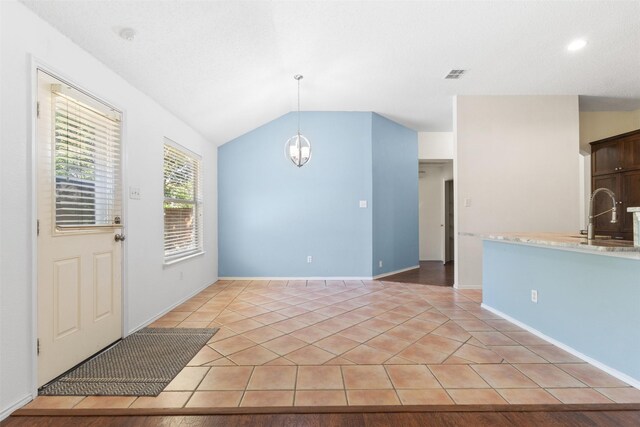 304 E Clover Park Dr, Fort Worth, TX 76140 - interior space with an inviting chandelier, light tile patterned floors, a sink, visible vents, and lofted ceiling